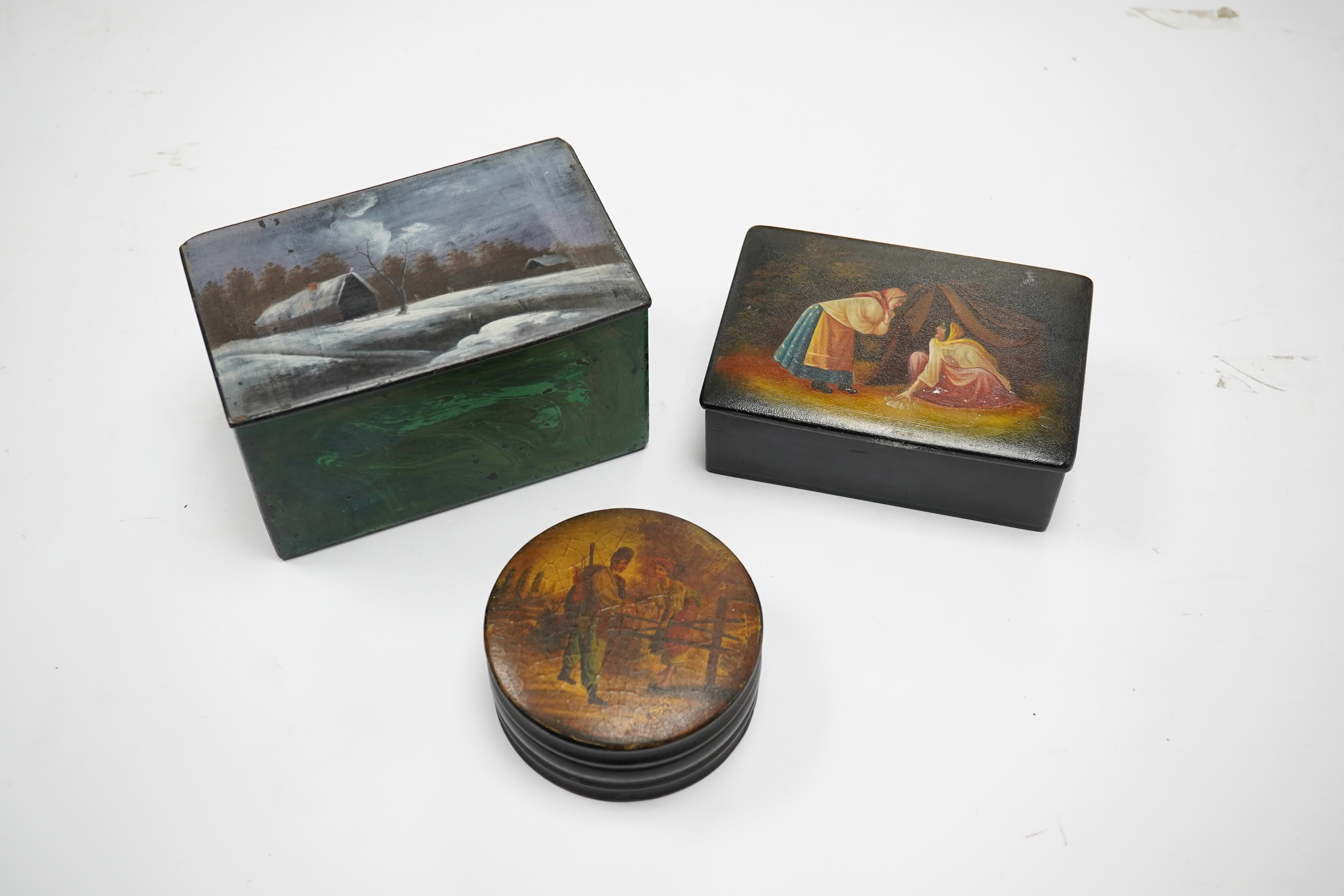 Three late 19th/early 20th century Russian lacquer boxes, largest 14cm. Condition - fair to good